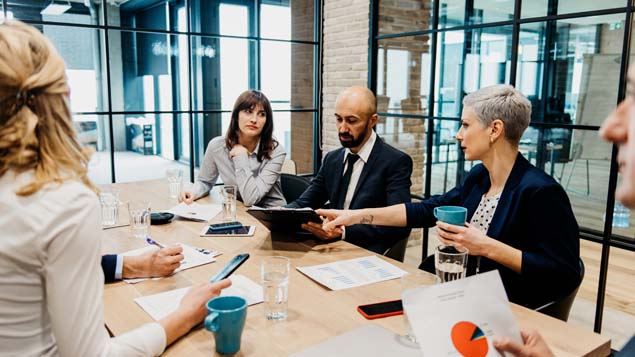 Boardroom reviewing financials