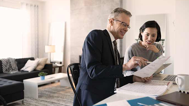 Advisor and Woman with Laptop Meeting