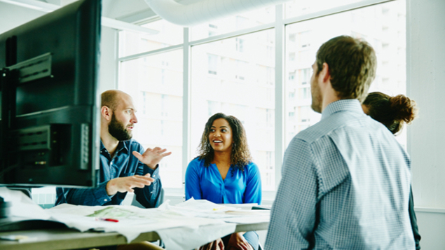 Businessman Leading Discussion During Meeting