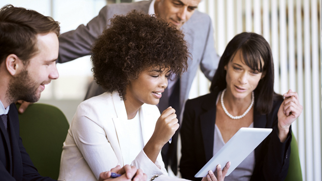 Businesspeople Looking at Tablet