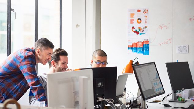 Businessmen at Computer and Tech Start Up Office