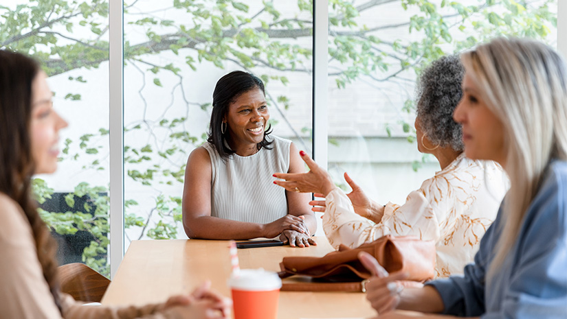 Adult women meet in a coffee shop
