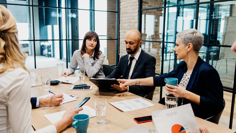 Boardroom reviewing financials