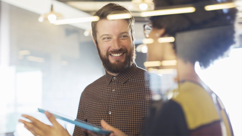 Business people using digital tablet in meeting