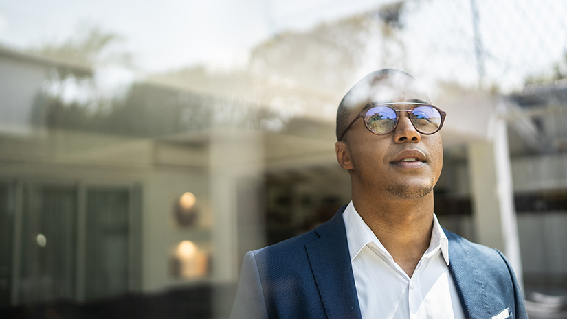 Businessman looking out of window