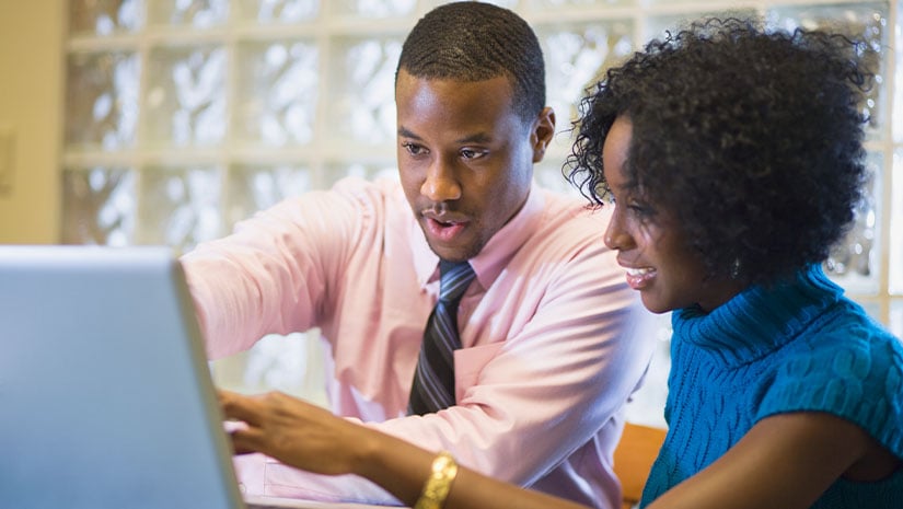 Businessman working with female coworker