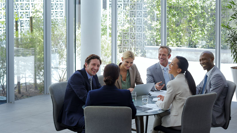 Businesspeople discussing at conference table