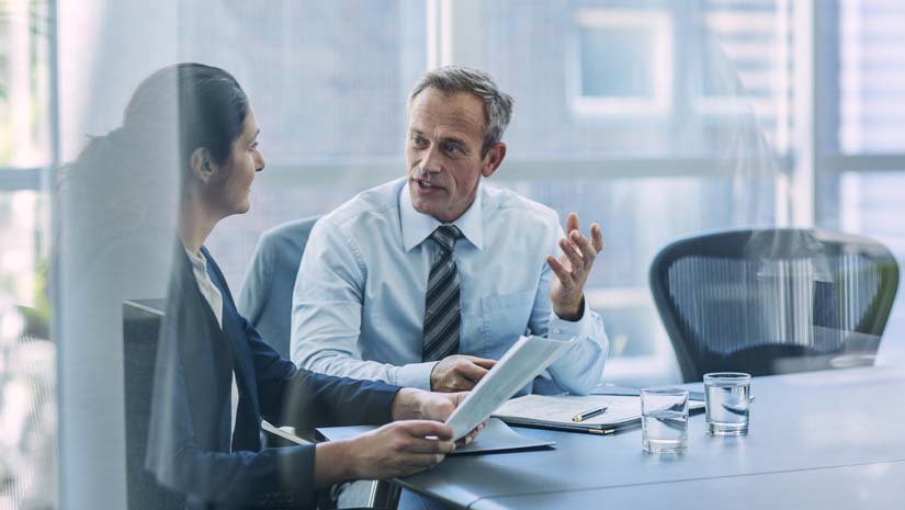 Businesspeople discussing strategy in office