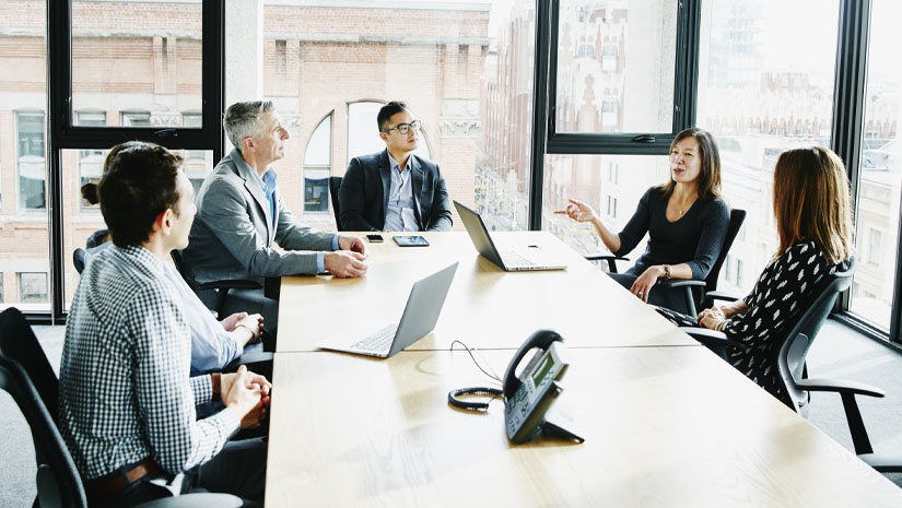 Businesswoman leading project meeting in office