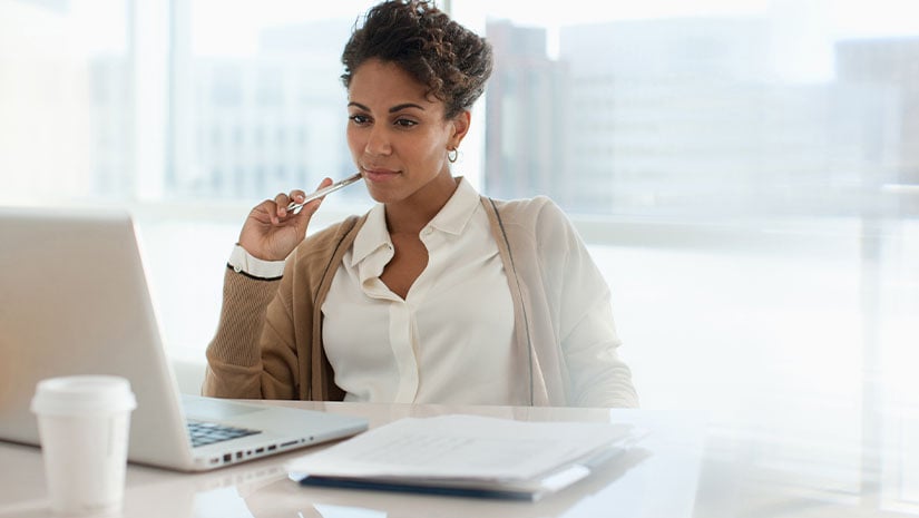 Businesswoman Using Laptop in Office