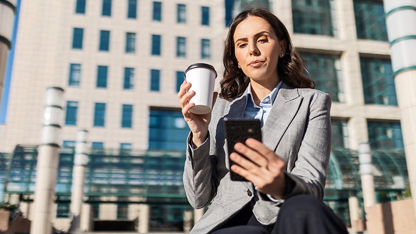 Businesswoman with Coffee and Smartphone