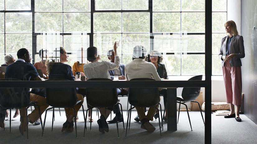 Businesswoman with colleagues in board room