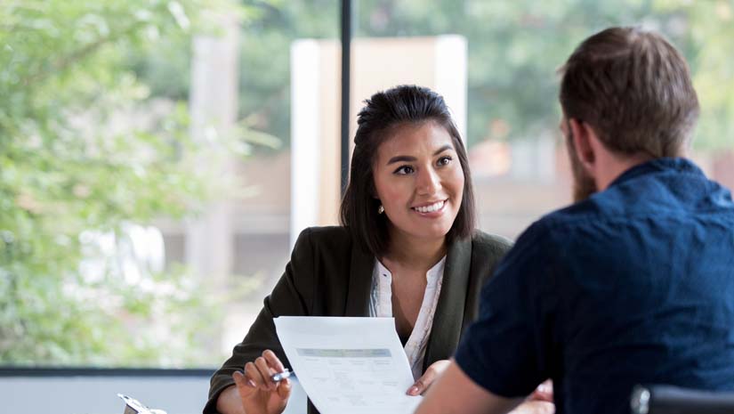 Cheerful Businesswoman Meets with Client