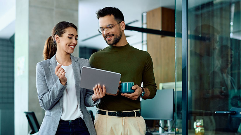 Colleagues using digital tablet
