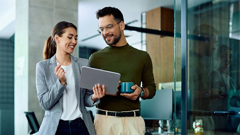 Colleagues using digital tablet