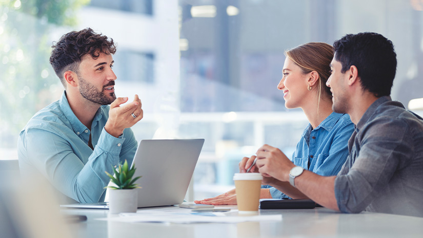Financial advisor with couple explaining options