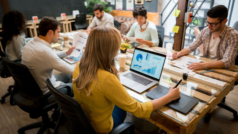 Group of people working at a creative office
