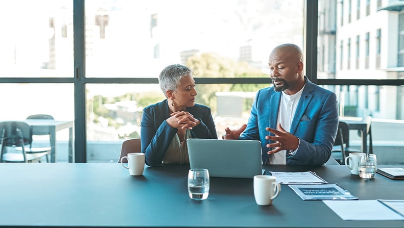 Meeting on a laptop in a corporate conference