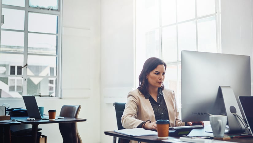 Shot of a young businesswoman working on a computer in an office