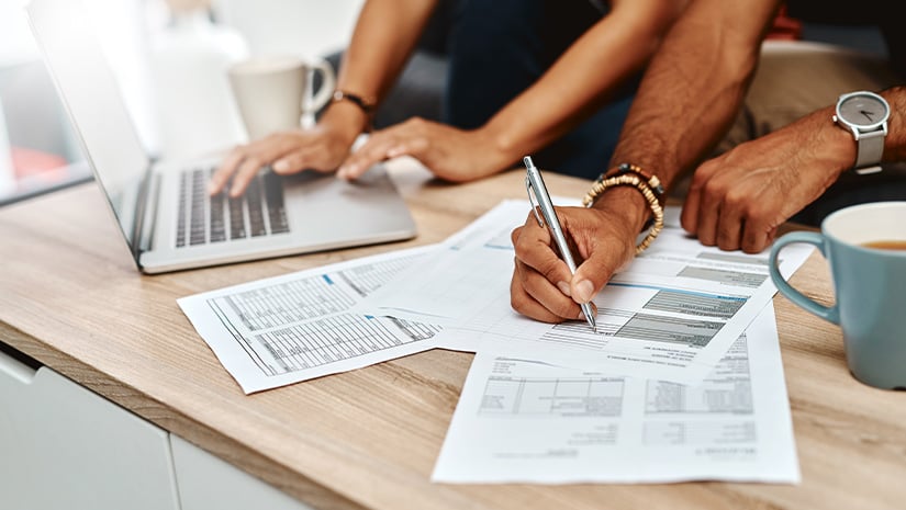 Cropped shot of a couple going over their finances together