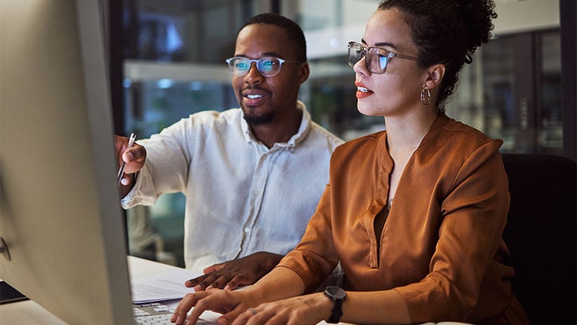 Teamwork and employees planning marketing strategy in a dark office