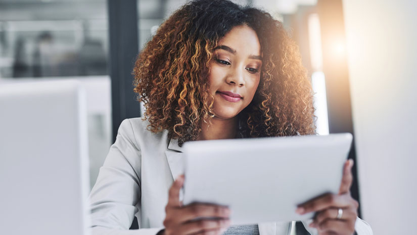Shot of a young businesswoman using a digital tablet in an office