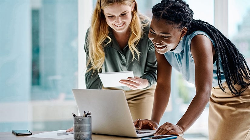 Two Diverse businesswomen working together