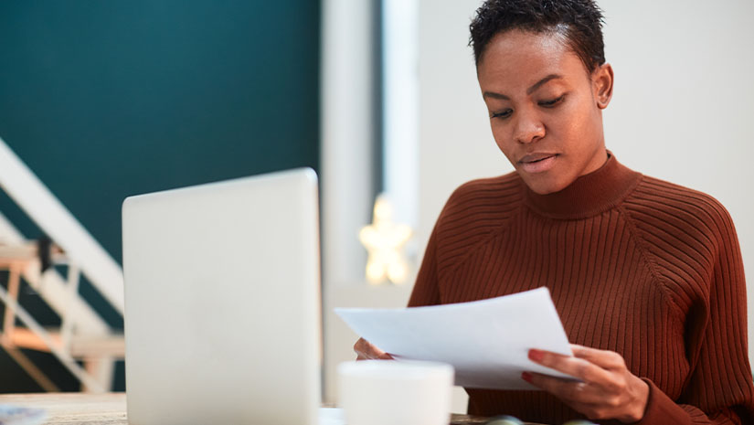 Woman working on her finances at home