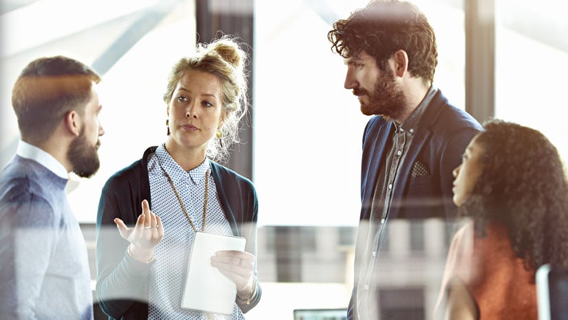 Group of young professionals collaborating in office