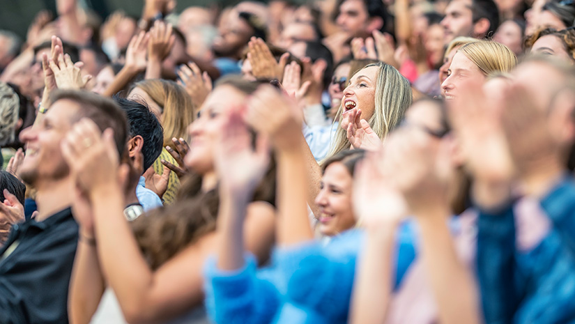 Stadium crowd cheering and clapping