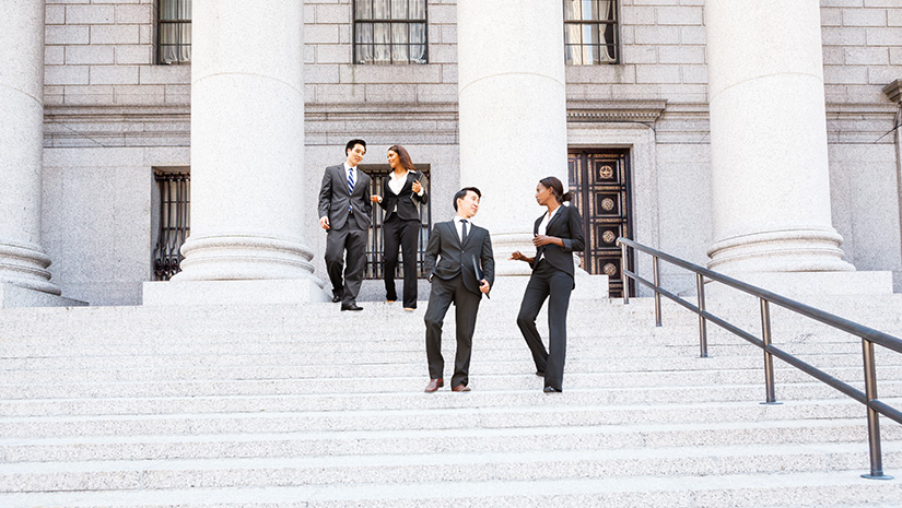 Four People Walk Down Courthouse Steps