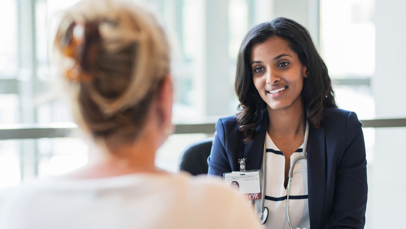 Doctor having a meeting with a nurse.