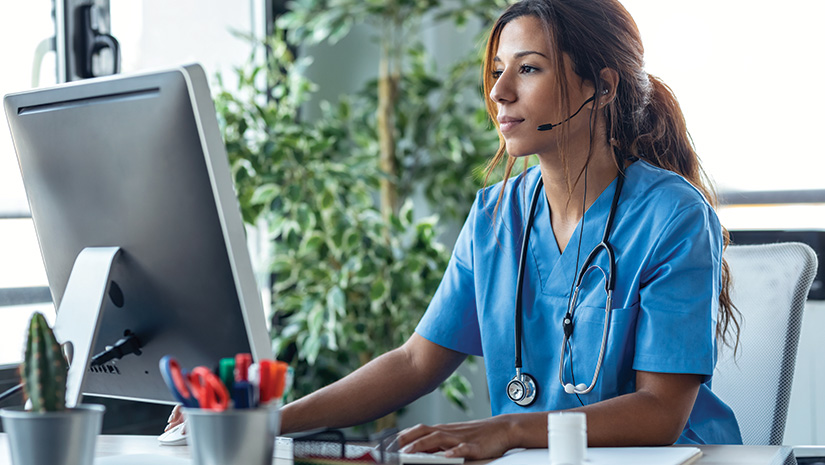 Female doctor talking with earphone
