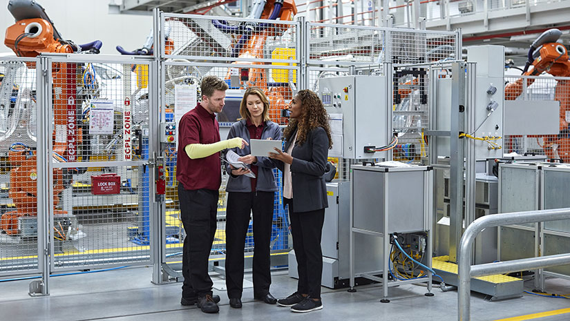 Coworkers Talking in a Factory