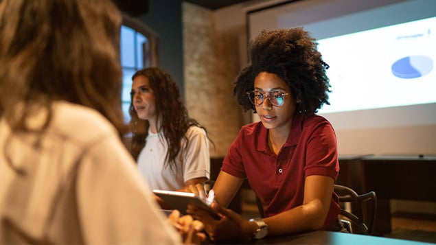 Businesswoman doing a staff meeting in the office