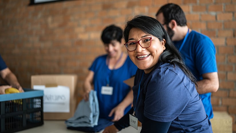 Portrait of a volunteer working in a community charity donation center