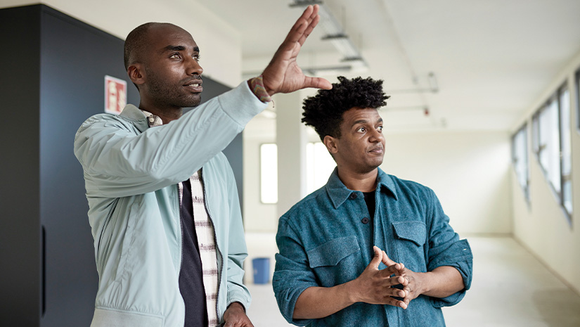 Client and Commercial Real Estate Agent Touring Office Space