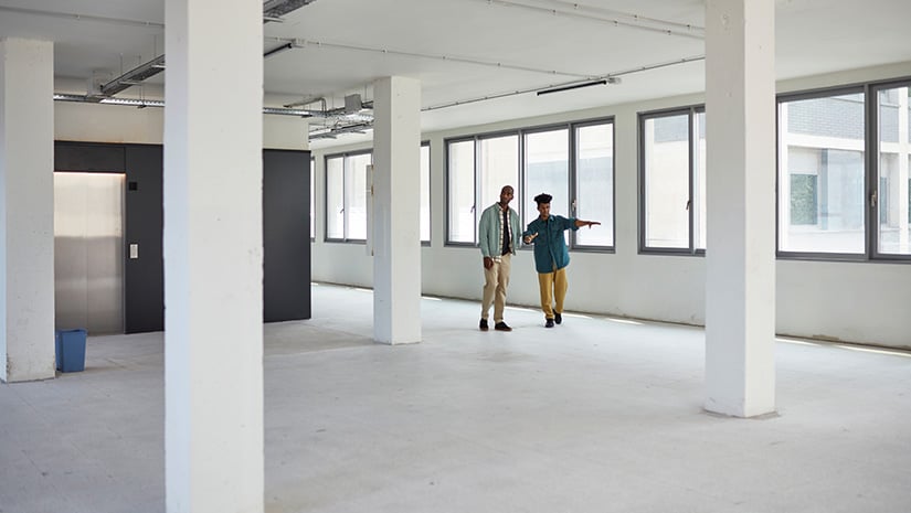 Commercial Real Estate Agent Showing Office Space to Client