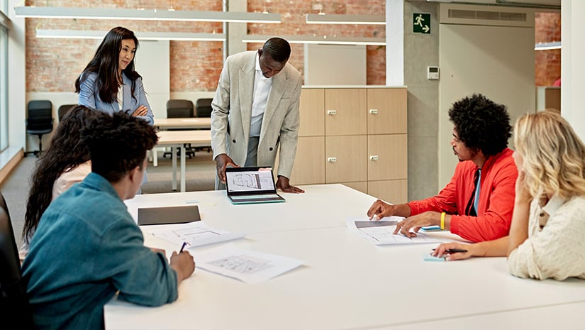 Commercial Real Estate Team Meeting to Discuss Property Data