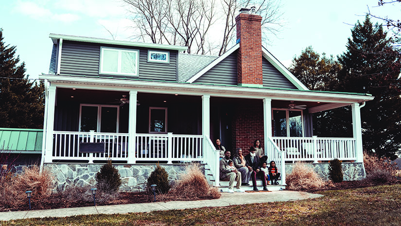 Portrait of Multiracial MultiGeneration family in front of home