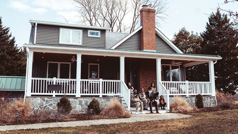 Portrait of Multiracial MultiGeneration family in front of home
