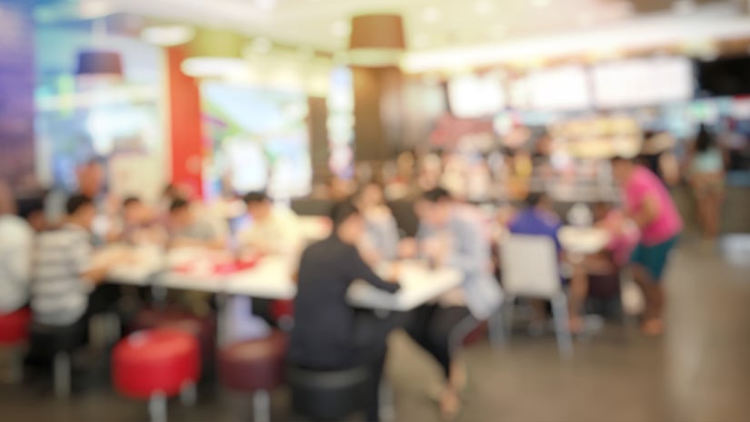 blurred abstract image of people standing for wait to order