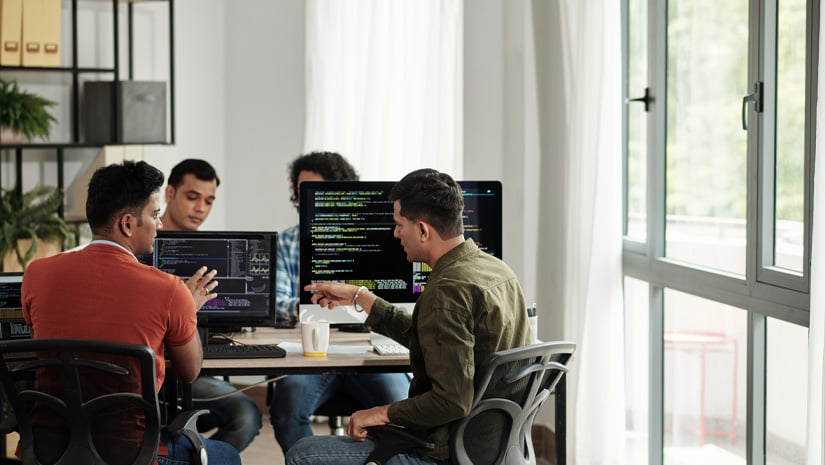 Developers Discussing Programming Code