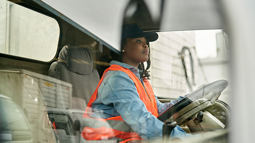 Black Female Truck Driver Photographed Through Window