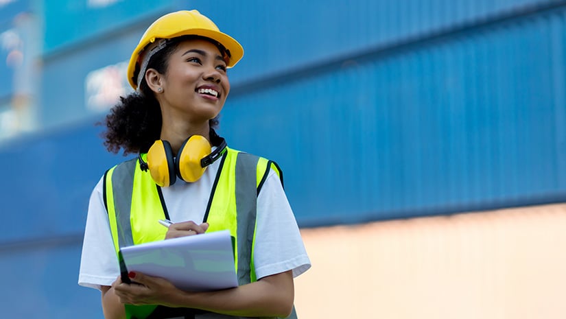 Foreman or worker hand holding checklist for writing and checking in goods