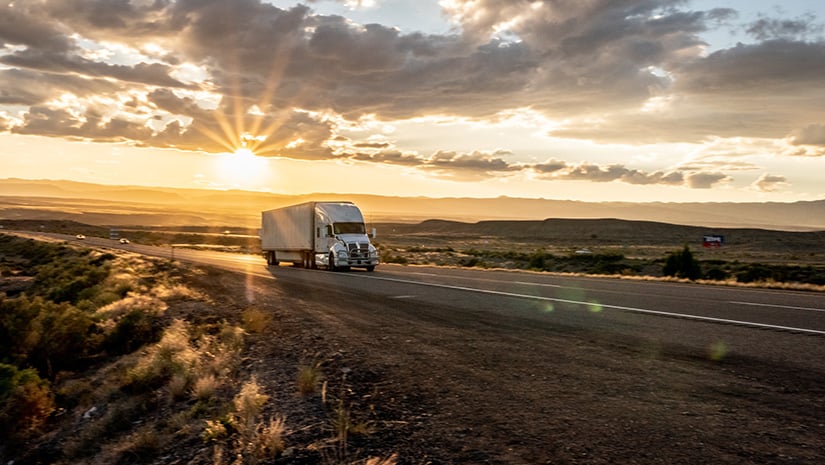 Long Haul Semi Truck Speeding Down a Four Lane Highway