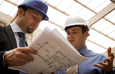 Two Men Discussing Blue Prints