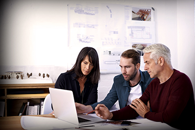 Architect Meeting Reviewing Laptop