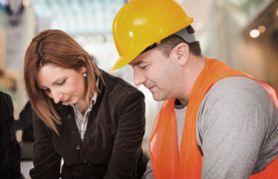 Construction Man Business Woman in Review
