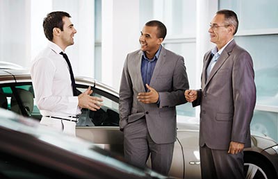 Business People Talking to a Salesperson